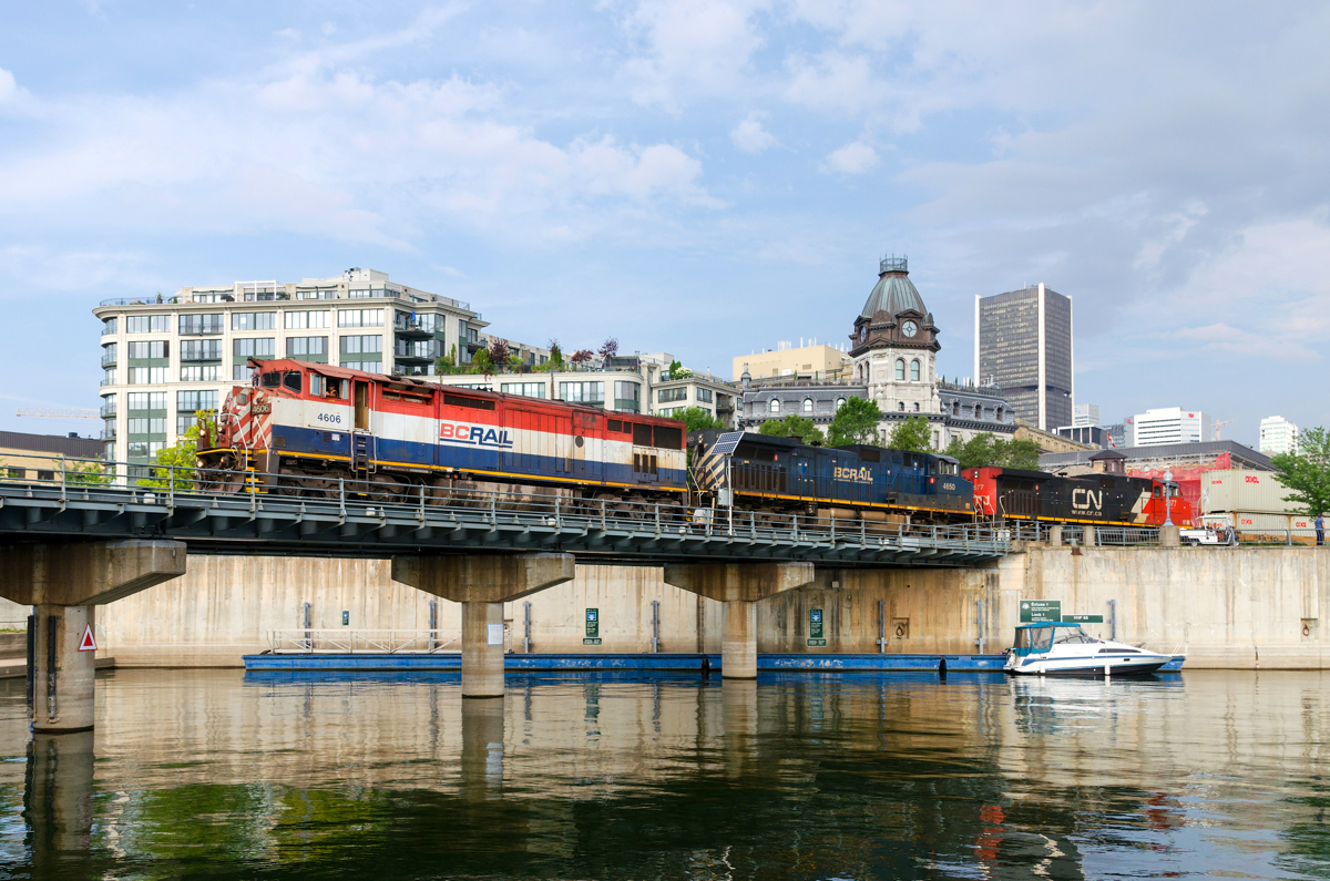 BC Rail units in two paint schemes lead CN 149 out of the Port of Montreal. Full lashup is BCOL 4606, BCOL 4650 & CN 2677.