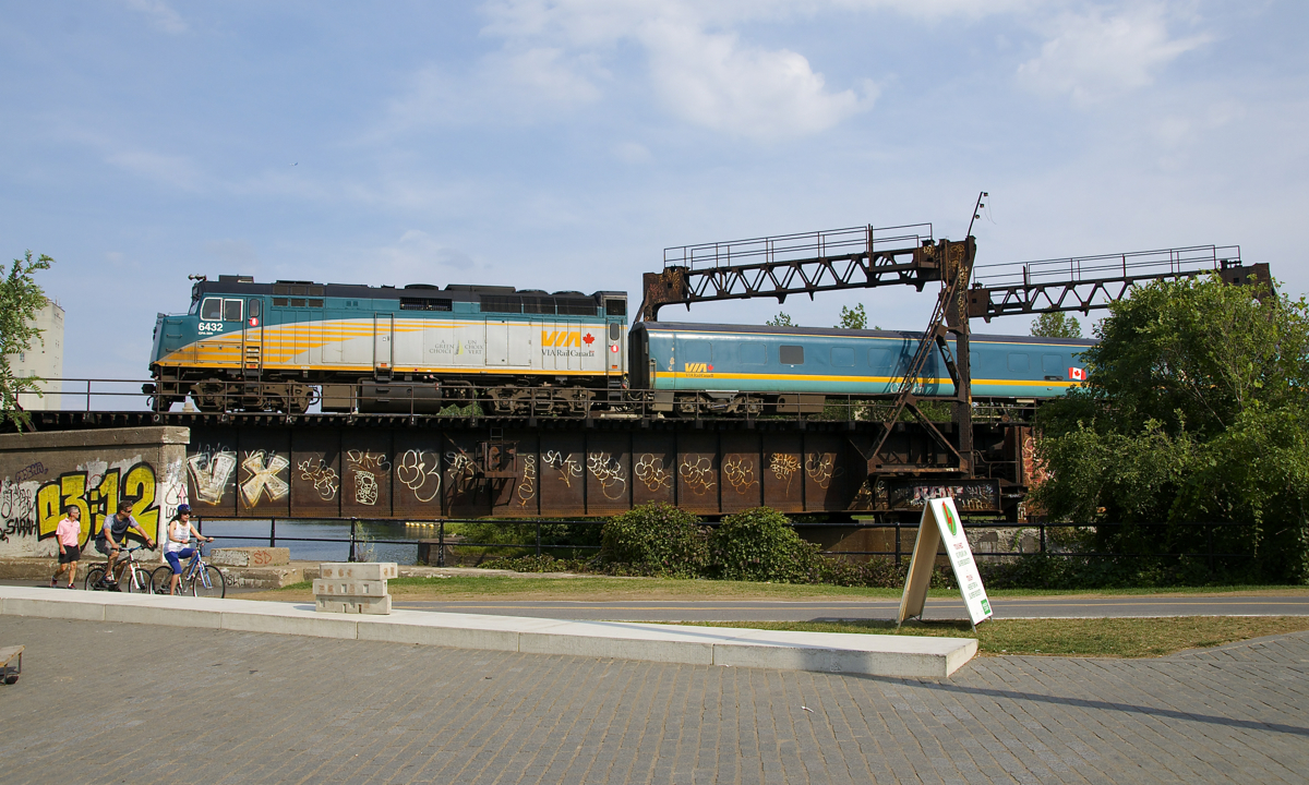 VIA 37 from Quebec City has VIA 6432 leading a Renaissance consist as it crosses the Lachine Canal in Montreal.