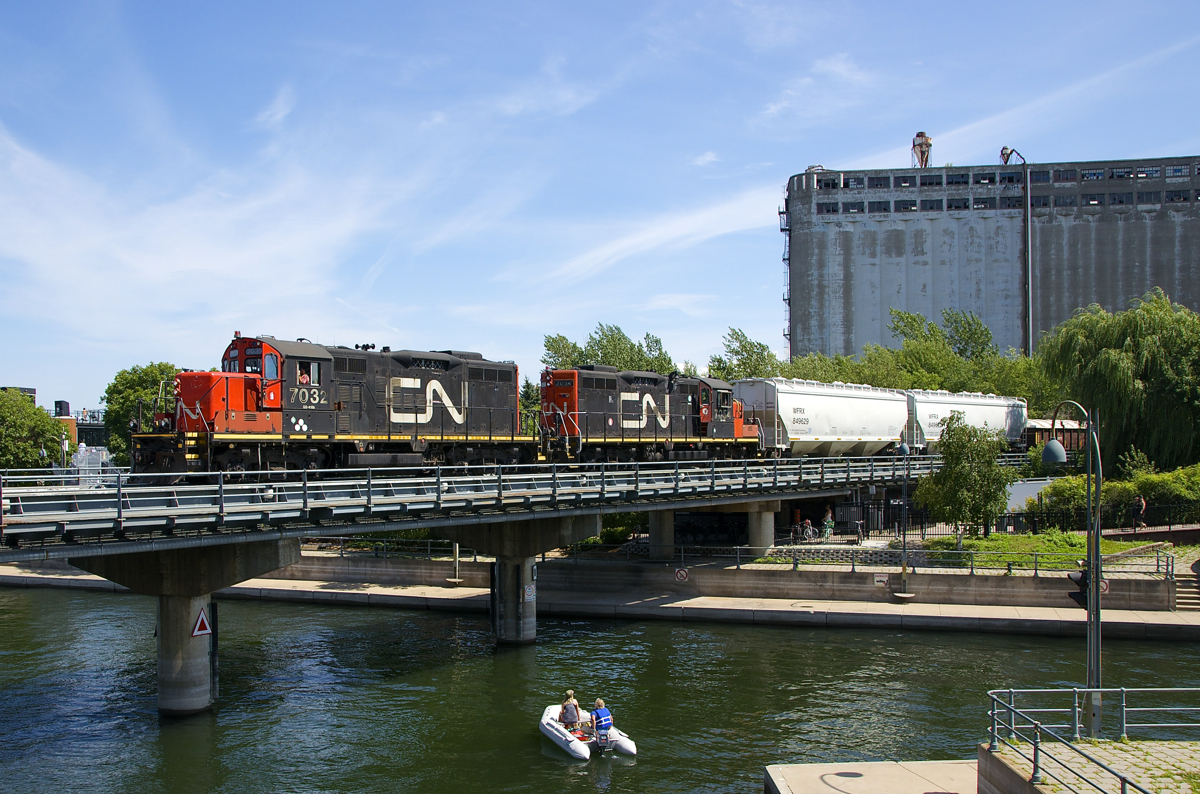 Back to our regularly scheduled programming. Almost exactly 24 hours after the CP Canada 150 train (with three F-units) crossed the Lachine Canal at this location to get to the Port of Montreal for its show, its back to normal as a CN switcher enters the port with a pair of matching GP9's for power (CN 7032 & 7054).
