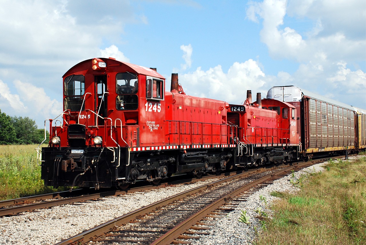 The Ontario Southland Woodstock Job gets all the attention for regularly running with F units and geeps, but the Cami Job is just as interesting.  Where else can you see a pair of SW1200s in regular service?  On duty at 16:00 this day, the crew had little switching to do before heading to the CN interchange.  The Cami job is shown taking the east leg of the wye leaving Cami.