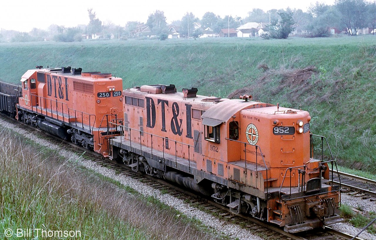 Detroit, Toledo & Ironton GP7 952 and SD38 250 are heading back to Detroit from Windsor through the Detroit River Tunnel in 1970, probably on an interchange train run. The banks are remarkably bare, but would be overgrown soon. DT&I was eventually acquired by the GTW (CN) in 1980.