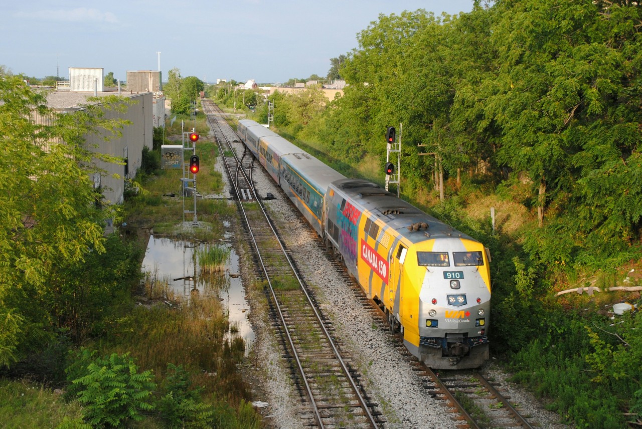 VIA 87 slows down for his station stop in Kitchener as it clears the Kitchener mile board.