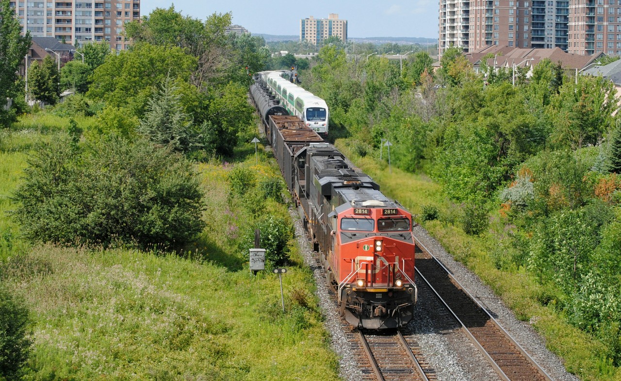 A northbound GO train zooms by CN A412 as it's approaching his destination of Mac Yard