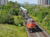 A northbound GO train zooms by CN A412 as it's approaching his destination of Mac Yard