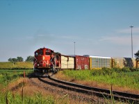 Here we have CN YVWS-02 (CN's Windsor Local) with CN 7046 & 7081 (GP9RMs) rounding the Pelton curve, and heading north towards CP's Walkerville JCT. Eventually this train would have take a stop before taking the wye at Walkerville, since CN A438 would only be 9 minutes ahead of them waiting for the clear to cross over  the CP Windsor Sub.