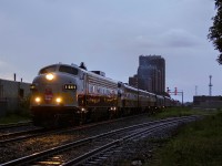 Same train, different location... Why not? I had seen CP's 150 train in Hamilton two days before, but failed to take advantage of the lighting when it was best around 8pm. It was clear I wouldn't be getting a sunset as the show at Lambton yard was coming to an end. Then it started to rain. While I hate the feel of rain, I knew it was a last resort to at least I'd have some decent contrast in my photo. I wasn't prepared, and had to resort to a one of my socks to clean my lens, as it was the only thing I had that was dry. Luckily I was able to dry it enough so the lens didn't flare.
<br><br>
As for more story on the train and location itself. It's probably well known at this point that the old F units have not proven the most reliable for this trip, with both 1401 and 4107 suffering ailments. A good reminder that all the power here is around 60 years old. All of the equipment was built for arch rival CN, and was used heavily into the Via Rail days, all except 1401 of which were used by them until 1998. So they've definitely been well used. It's too bad CP didn't have the foresight to keep some of their own historical equipment for this train.
<br><br>
What about those signals? Despite the West Toronto diamond being buried three years ago to prevent conflicts with Weston Sub passenger trains, the searchlights still stand just west of where the diamond once was. Osler now has LED signals at both ends of the interlocking, and it's likely many signal blocks along the North Toronto Sub will follow in the coming years. F units and searchlights seem to fit well together, but it's very possible that the next time the Royal Canadian Pacific comes down to Toronto, there might not be any searchlights in the area to knock out. It was just under three years earlier E.H.H and the boys last brought this train onto the North Toronto Sub. A short period of time, but plenty of time for change, and plenty of changes there has been on CP since then. If there's anything that hasn't changed, it's the blue smoke blowing out of CP 4106's stack, an indication believably of low oil that F units proudly announced back in the day. Surely some of you old timers remember the blue smoke! 
