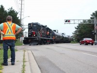 On most days one member of the OBRY crew drives ahead of the train typically ending up at Streetsville to throw any switches and derails necessary before the train arrives. Today the train was a stunning 11 cars when it arrived at Streetsville Junction. A member of the crew is seen looking on as the train arrives to leave its cars at the CP interchange. Once the train is clear he will reset any switches and derails that need to be realigned. The train left this day with only 5 tank cars.
