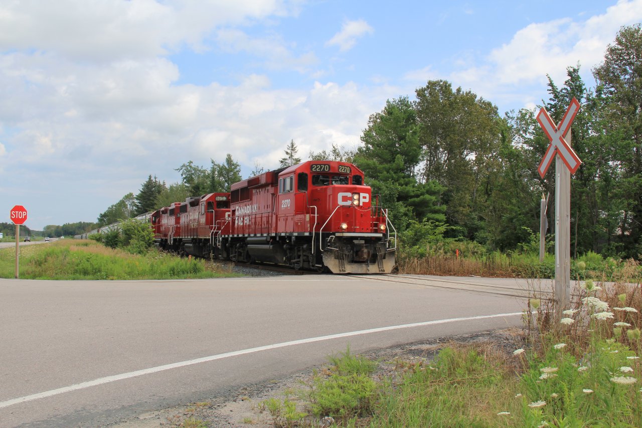 Caught the Havelock job heading west at mile 96 of the Havelock sub crawling along on its way back to Toronto after coming up the day before.

About 2 hours, and 20 miles later, I would catch him again crossing the Trent/Severn waterway.