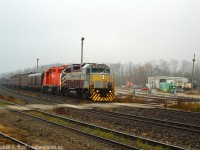 With CPR's 150th Train cruising across Canada at the moment, I present another interesting day when a deadhead move of the Business Train ran through Ontario in 2006. Planned to be a sunny day, it was foggy when we arrived and the fog slowly burned off just in time. A pair of GP38's and the trailer a GP38AC make this a rather interesting and rare consist that about a dozen of us captured on this fine morning. The OSR shop area is in full view and you can see the crew pulling power out of the shops just as CP went by.