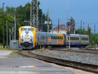 Under threatening skies, VIA train 645 enters the CP Belleville Subdivision crossing over to the Brockville Subdivision toward Toronto, sadly trains no longer stop at the Smiths Falls CP station instead stopping at a shack north of town, if they stop at all.