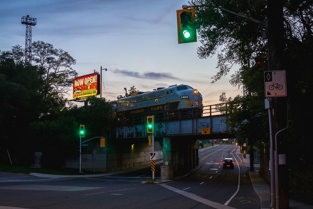 Aberdeen Nocturne: The classiest train on the CPR backs into Hamilton's Aberdeen Yard, passing over a bridge stencilled for the TH&B.