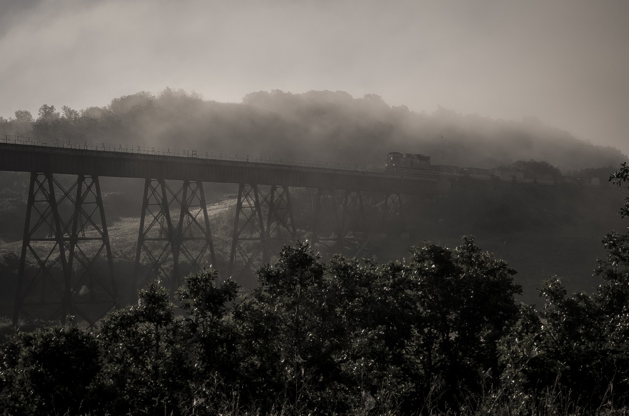 CN crossing Westbound on the Uno viaduct in an early morning mist.