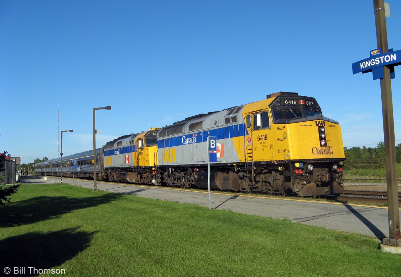 Doubleheading GMD F40PH-2D units are in charge of VIA train 67 today, shown stopped at Kingston station behind consecutively numbered 6418 and 6419 on August 12th 2010.