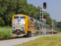 Passing the former station grounds and sidings, Train 73 led by a shiny 905 kicks up the dust as it crosses Jeannette's Creek Road on it's way to Windsor.