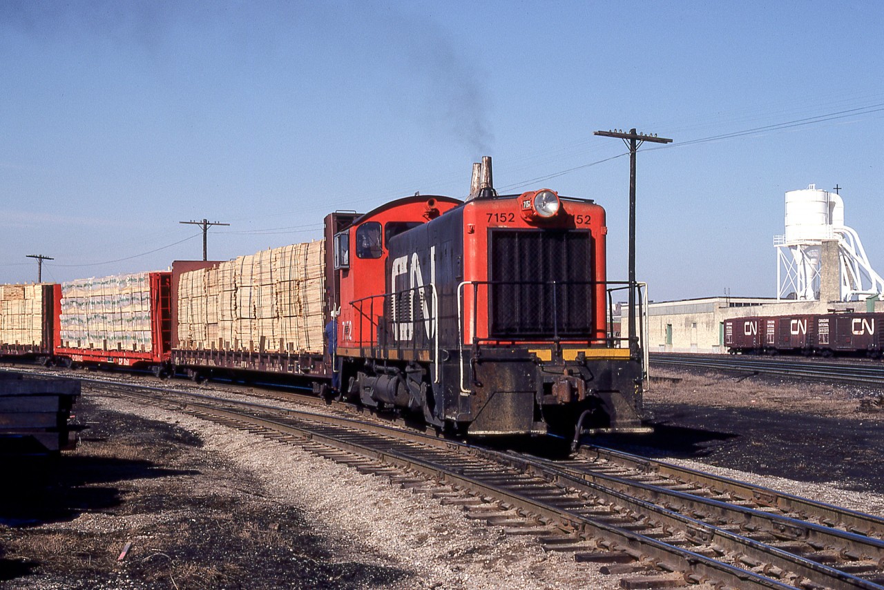 CN 7152 is working in London, Ontario on March 24, 1981. Soon the early morning sun would give way to thick clouds, but on this morning, CN 7152 looks just right.