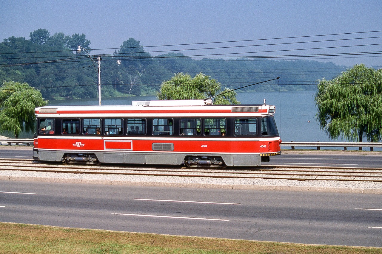 TTC 4082 passes a lake on August 12, 1988. Whether TTC streetcars are in the heart of the city or in a attractive scene such as this one, they can capture the heart of a transit lover.