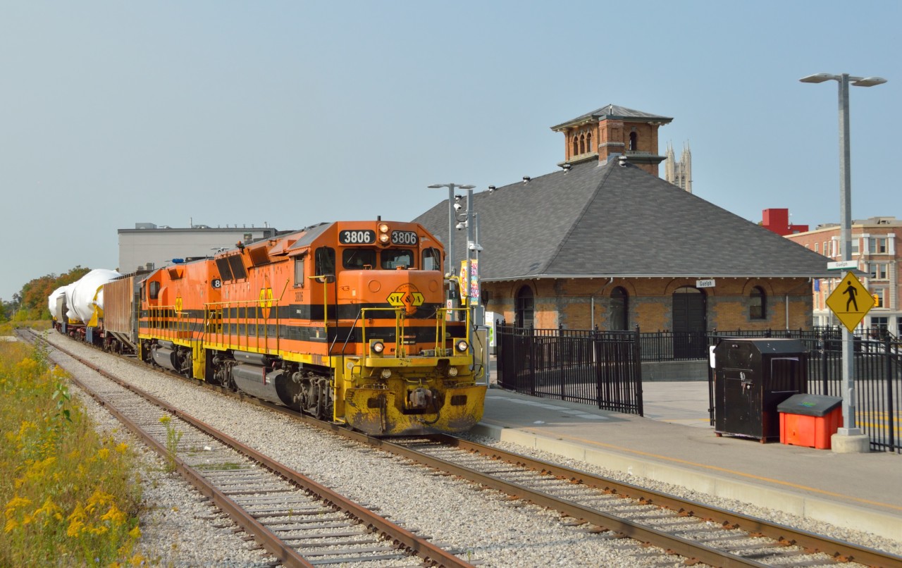 GEXR 582 creeps past the 1911 built GTR station at Guelph with two 520 ton steam generators from Babcock & Wilcox, each carried on two 12-axle flat cars.  The loads are to be interchanged to CN at Georgetown and taken to Stuart Street Yard in Hamilton to be forwarded by the Southern Ontario Railway to Hamilton Harbour.