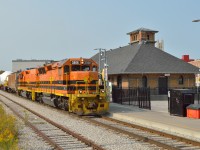 GEXR 582 creeps past the 1911 built GTR station at Guelph with two 520 ton steam generators from Babcock & Wilcox, each carried on two 12-axle flat cars.  The loads are to be interchanged to CN at Georgetown and taken to Stuart Street Yard in Hamilton to be forwarded by the Southern Ontario Railway to Hamilton Harbour.