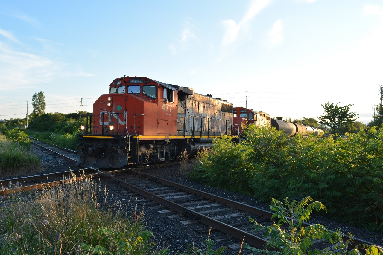 Caption: Caption: Nearing Formet, CN L584 crosses the old CP St. Thomas Sub that connected to the CASO. The connection being torn out for many years now; OSR operates on it to this day using it for tank car storage further ahead in the foreground