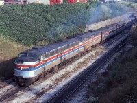 Amtrak No.64 (Detroit-New York City) exits the East Tube of the Detroit River Tunnel into sunny Windsor, Ontario on Aug 14th 1978.  