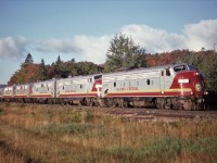 Algoma Central train No 1 (Techincally Wisconsin Central) with a Five-of-a-kind F-Unit consist climbs out of the mist and into the early morning sunshine at Heyden, Ontario. 