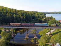 Bound for Greeville Jct Maine, Central Maine & Quebec Job#2 rumbles high above Eastman Quebec