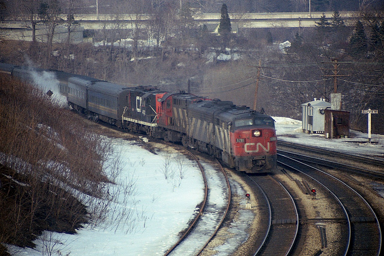 Train #75 I marked in my notes as "late" as this 14 car weekend westbound comes off the Oakville onto the Dundas Sub at Bayview in March of 1978. Typical mix of power is CN 6781, 6625, 3124 and 4102. This train typically passed thru Bayview around 1615; on this day it was 1645.