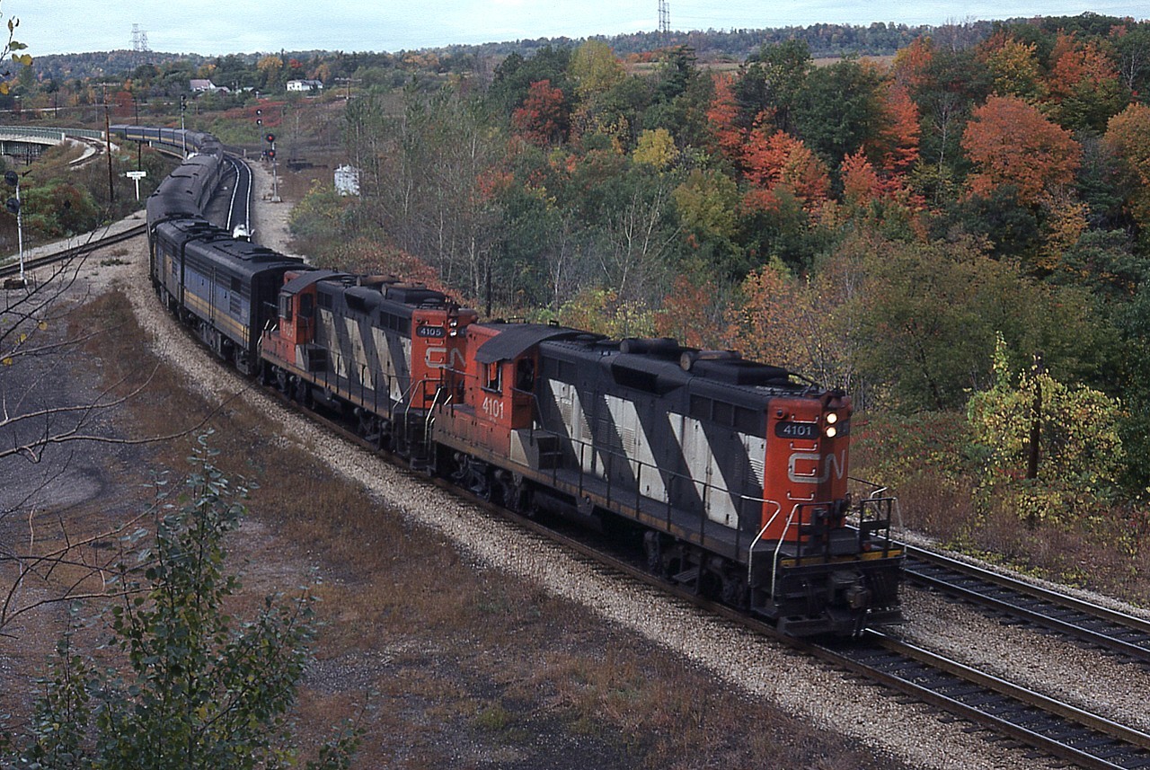 Due to health issues I guess this falls' railfanning will be more of a trip down memory lane than anything else. And some of the memories were great. Shown here in the height of the fall colour season back in 1979 is actually a typical weekend passenger thru Hamilton West. Nice and long with unpredictable  power up front. This eastbound is most likely early afternoon #72. But I am not sure. The days of VIA were young, so it is still CN we would see on many trains. CN 4101 and 4105, a pair of GP9 units set up to run on passenger service lead unknown units, VIA "B" and "A" by the look of it. Certainly a wonderful power combination compared to present day. But it was not all wine and roses. We had to endure seemingly endless Budd cars and Tempo trains in our efforts to snare images of "the good stuff". It was all worth it.