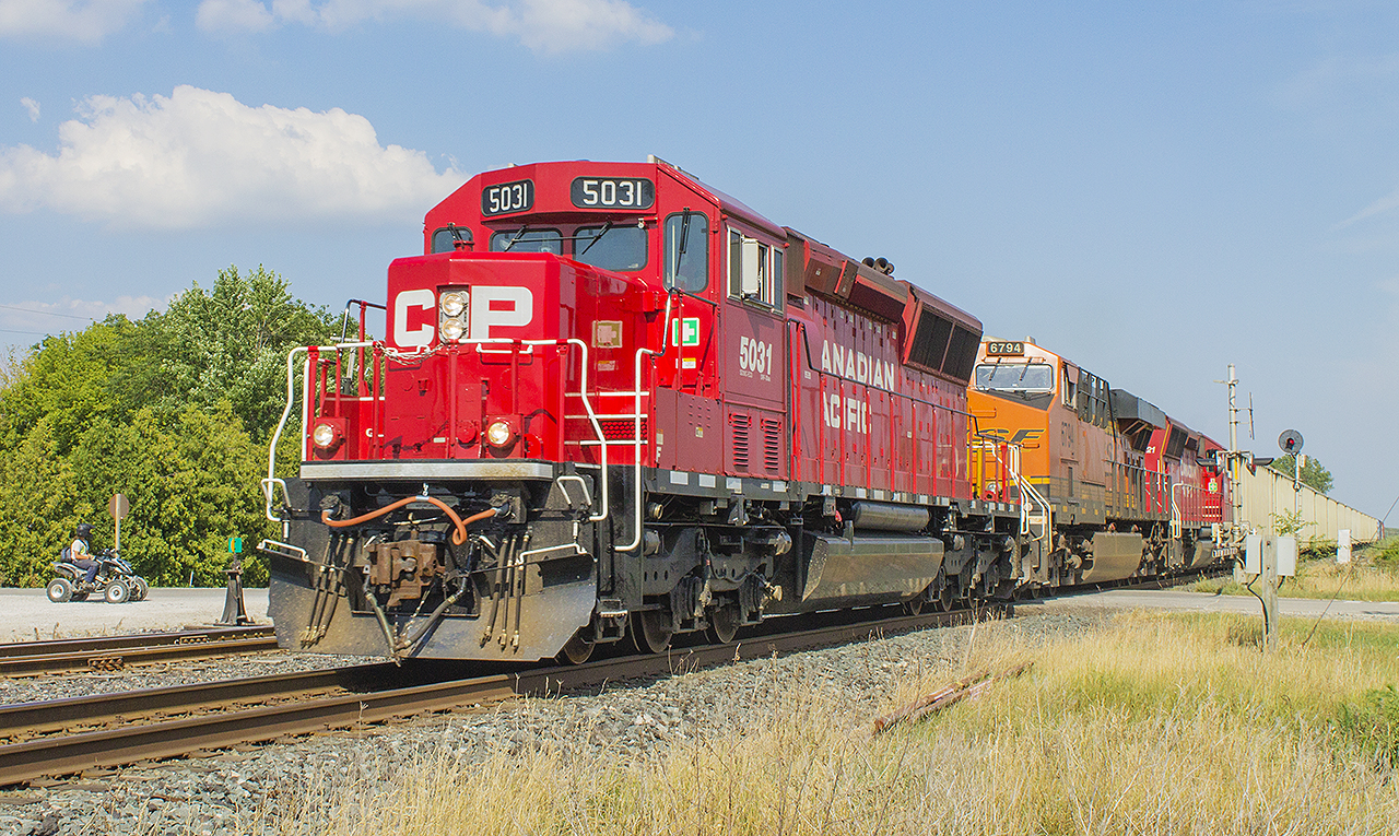 A great start to my vacation. Such colourful consists on the Canadian Pacific. This train with a BNSF sandwiched in between two CP locos led by 5031, at Tilbury.