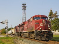 <b> THE RARE MORNING EASTBOUND... </b> It is a beautiful sunny morning in downtown Chatham, where 240 makes it's way along one of the tightest rail corridors with numerous level crossings. Led by CP 8747 and 8717, it is about at the half way mark already having crossed or still blocking (west to east) Bloomfield Road, Keil Drive, Merritt Avenue, Inshes Avenue, Lacroix Street, West Street, Raleigh Street, Jeffrey Street, Queen St., Centre Street and finally Wellington Street in the foreground. Surprisingly, this train still has yet to cross William Street, the King and Adelaide intersection, Colborne and Princess Streets. It will exit Chatham as it crosses Longwoods Road and Prince Albert Drive. 