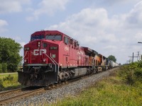 <b> MORE "FOREIGN POWER IN ONTARIO (FPON)",</b> as CP 9768 picks up speed with an unidentified BNSF unit and NS unit # 7231 trailing, after a meet with an eastbound train at Bloomfield Road in Chatham. 