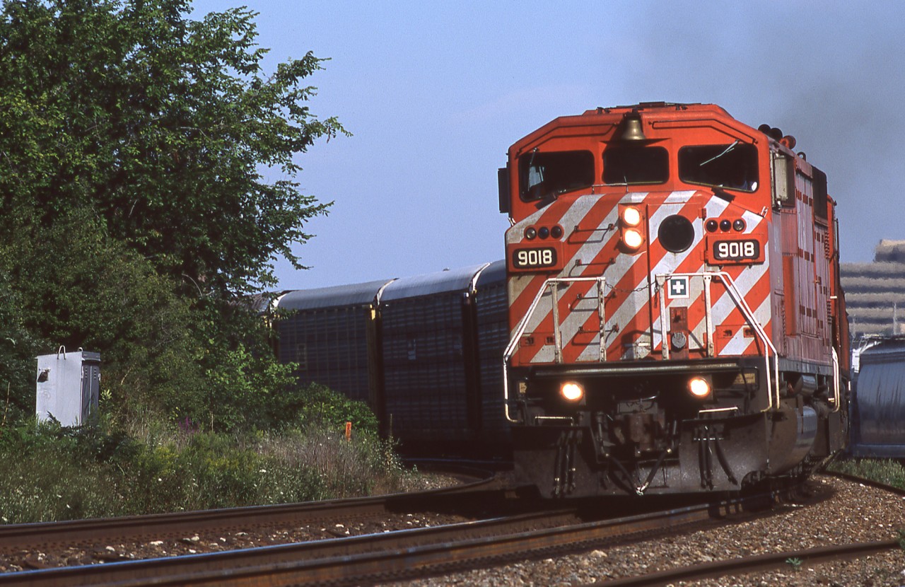 CP 138 rounds the bend at Streetsville Junction with now retired GMD SD40-2F CP 9018 on the point.