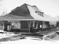 From <href="http://www.railpictures.ca/?attachment_id=30717"> Arnold Mooney's recent shot of the old CP station in Blyth,</a> I had to dig up this old photo of mine. I first came to Blyth around Christmas of 2001...and dragged my poor brother in tow. The station was saved, and moved to the south end of town on London Road (Hwy. 4). It became a Liquidation Store as part of the Old Mill complex. Although I haven't been back to Blyth in about 13 years, I am hoping this building is still enjoying it's quiet retirement in decent condition.