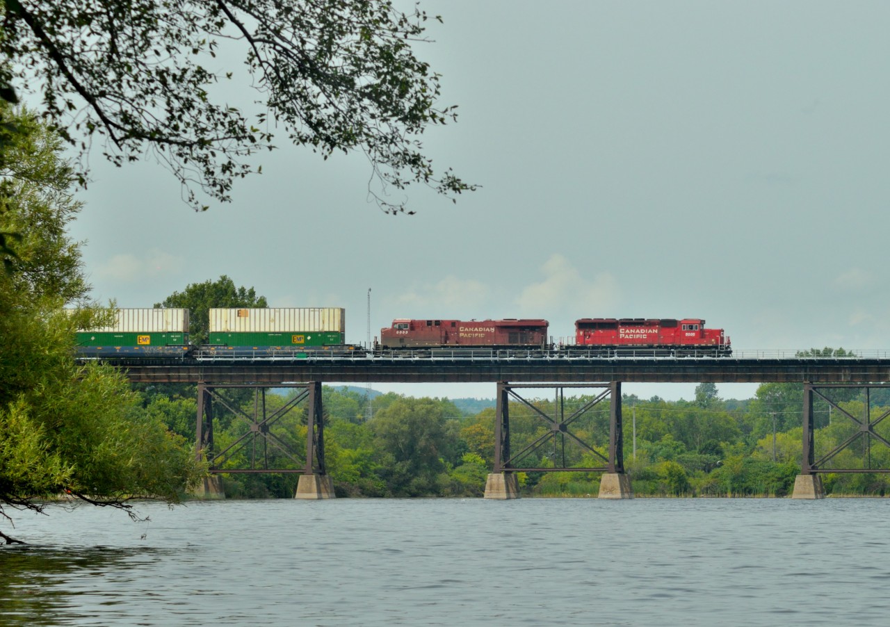 CP 142 crosses the Trent River at Trenton, ON approaching a meet with CP 651 just across the bridge.