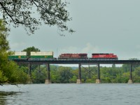 CP 142 crosses the Trent River at Trenton, ON approaching a meet with CP 651 just across the bridge.