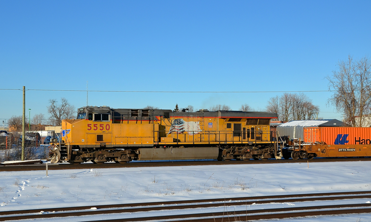 CP 143 is starting to leave Dorval with UP 5550 as the sole head end unit. KCS 4166 which was trailing it on CP 142 the day before was used as mid-train DPU.