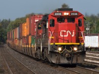 CN Q148 rolls slowly into Brantford with a C40-8 leading as they try to get a hold of a foreman working out at Mile 21.