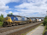 With an increasing number of CSX locomotives in the YN2 paint scheme being stored, taken off the roster or repainted, it's becoming rarer and rare to catch a solid YN2 consist, but I was lucky to catch two YN2 AC4400CW's (CSXT 94 & CSXT 139) operating elephant style on a 320-axle CN 327 which is seen passing through Dorval.