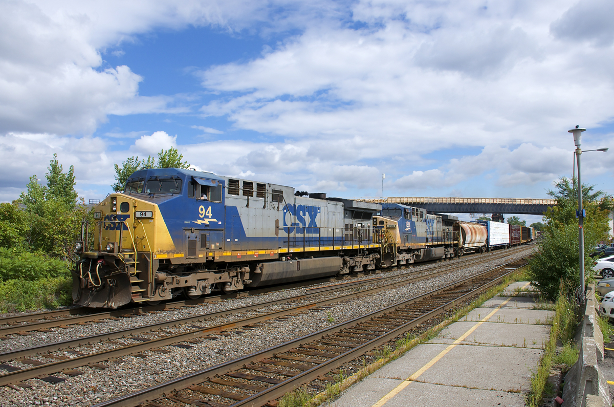 With an increasing number of CSX locomotives in the YN2 paint scheme being stored, taken off the roster or repainted, it's becoming rarer and rare to catch a solid YN2 consist, but I was lucky to catch two YN2 AC4400CW's (CSXT 94 & CSXT 139) operating elephant style on a 320-axle CN 327 which is seen passing through Dorval.