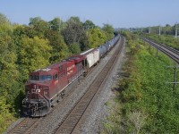 CP 8735 brings up the rear of loaded ethanol train CP 650 as it rounds a curve in Beaconsfield. Up front is much cleaner CP 8723.