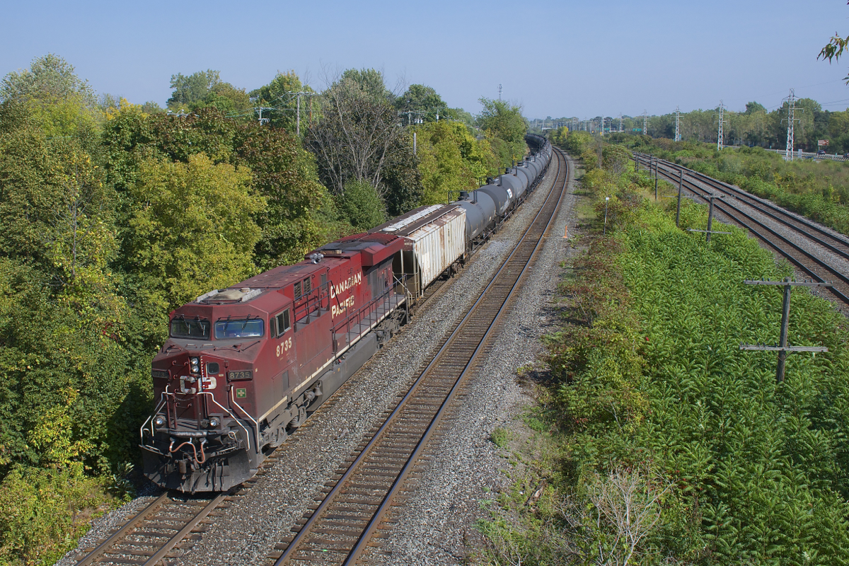 CP 8735 brings up the rear of loaded ethanol train CP 650 as it rounds a curve in Beaconsfield. Up front is much cleaner CP 8723.