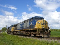 A pair YN2 AC4400CW's (CSXT 94 & CSXT 139) operating elephant style are the power on a 320-axle CN 327 which is seen passing on the Valleyfield Sub wye at Coteau.