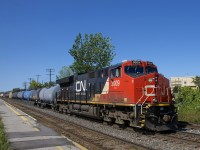 CN 3009 leads CN 368 through the VIA Dorval Station, with CN 2311 operating mid-train.