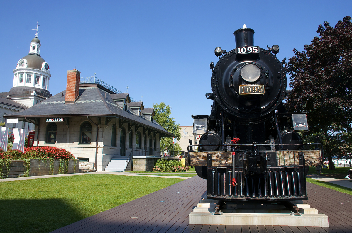 Built by the Canadian Locomotive Company in Kingston in 1913, 4-6-0 CP 1095 is preserved in its hometown by the waterfront along Lake Ontario. To the left is the former CP passenger station which now serves as a tourist bureau and further to the left is the City Hall