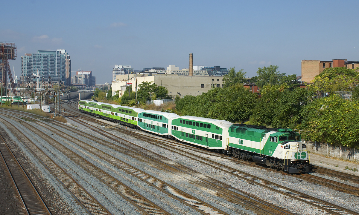 F59PH GOT 562 (one of eight remaining F59PH's on the roster) leads GOT 270 from Mount Pleasant towards the Bathurst Street overpass a bit west of Union Station in Toronto. The paint schemes and equipment is a mix of old and new with the veteran F59PH and two cars in the older paint scheme up front and four cars in the new paint scheme at the rear, including a new cab car. Waiting in the wings at left is MP40H-3C GOT 606, which will soon follow eastwards.