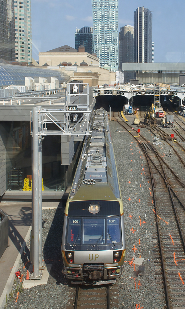 A Union Pearson Express shuttle train is leaving Union Station in downtown Toronto, bound for Toronto Pearson International Airport. Trains arrive and depart from here every fifteen minutes.