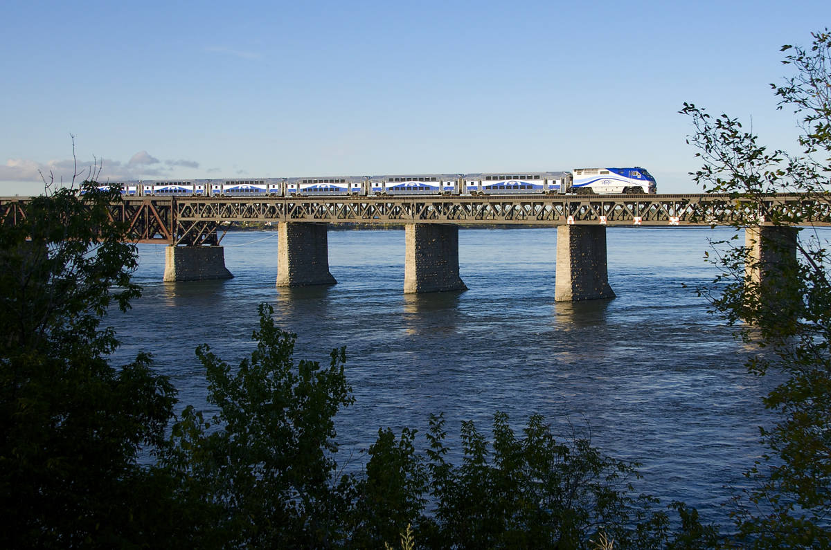 One week only. Due to emergency work being performed on Autoroute 138 in Montreal this week, Candiac-line trains had extra cars added, and even one train consisting entirely of multilevel cars. These cars have not been in use on this line since 2013, when the Comet cars came back from refurbishing. Today was the last day that the multilevel consist was in use. Here it deadheads back to the South Shore during the morning rush hour as it crosses the St. Lawrence River.