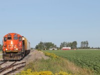 Here we see CN 7071 continuing down the line while passing an old siding. This siding has been discontinued as the rail from the switch track has been cut up slightly. 