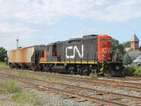 CN 7071 is ready to push one grain car into the side track for AGRIS in Thamesville. It would lift three cars out before dropping this car. I never knew it serviced the small AGRIS Co-op. I only knew it serviced the four grain elevators to the right of me, (out of this photo).