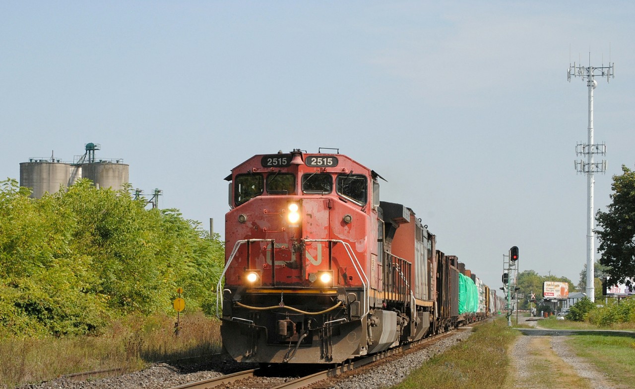 A wonderful "All Canadian Cab" lashup pulls a rather later M385 through the town of Strathroy